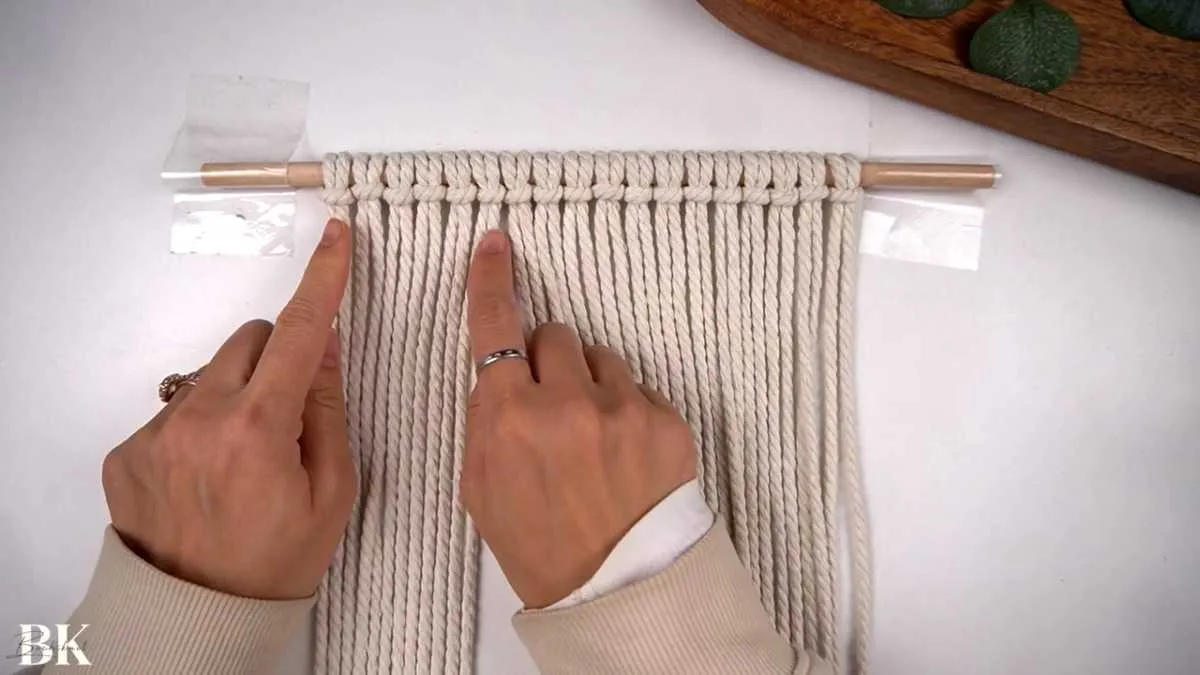 Separating macrame cords into three groups of 12 for the diamond pattern