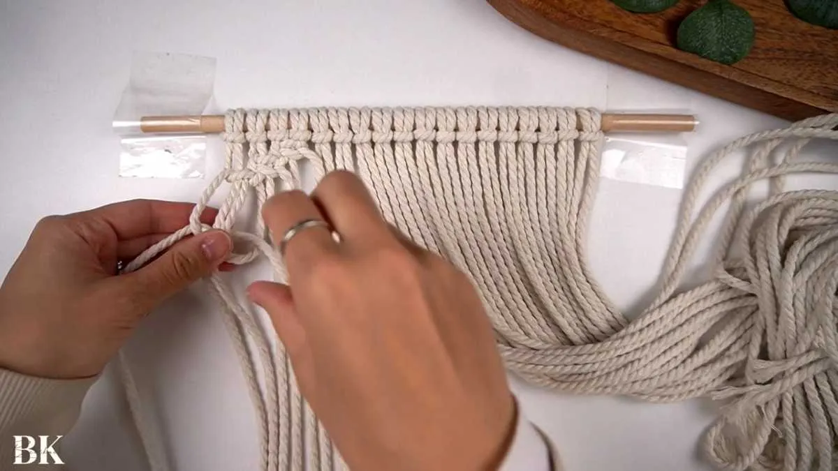 Working the diagonal square knots to form the first macrame diamond shape