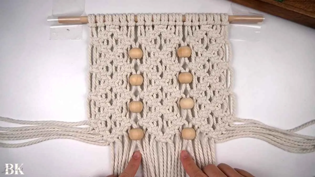Nearly complete macrame wall hanging showing all diamond rows and bead placement